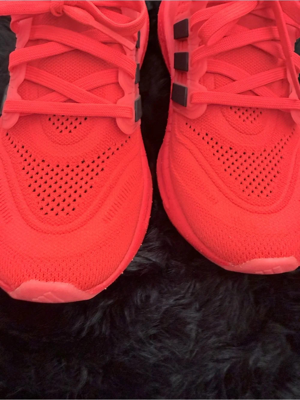 adidas red orange Ultraboost Running Sneakers.